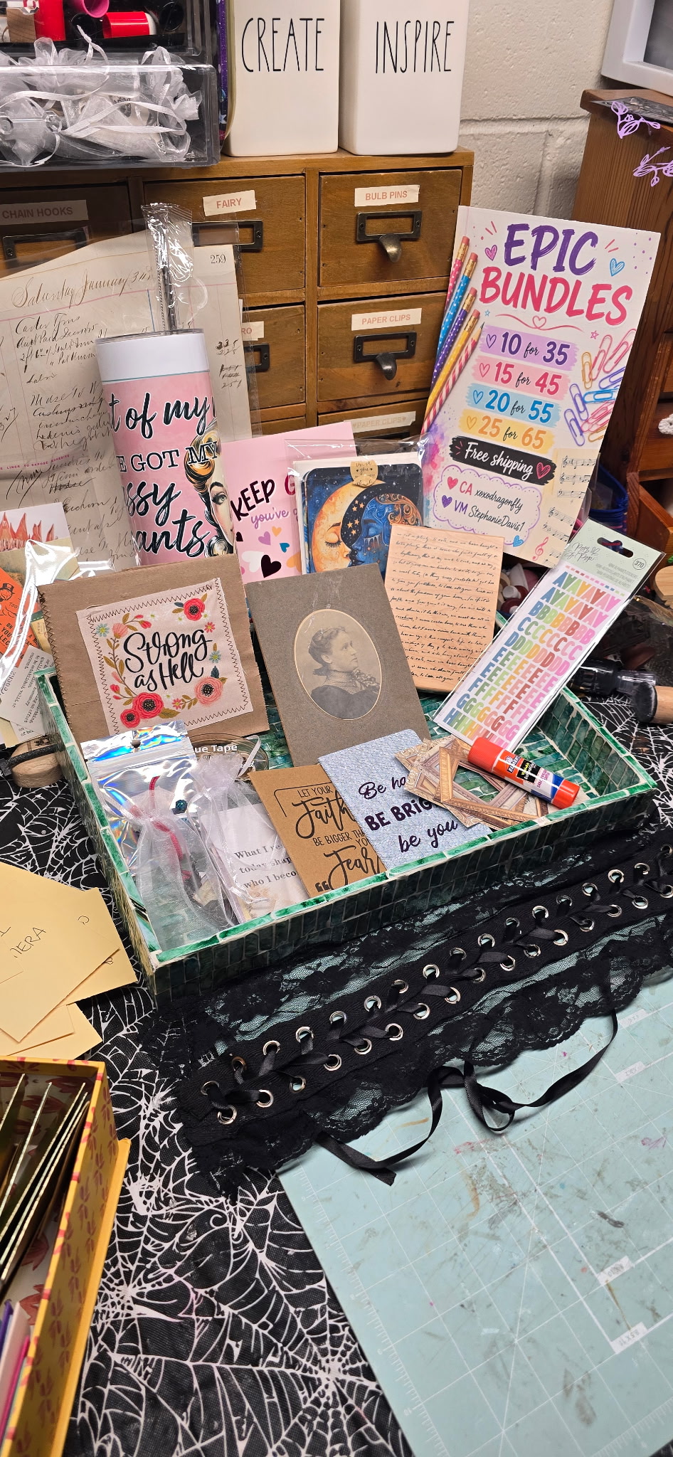 A junk journal bundle tray of vintage papers, cards, stickers, and supplies